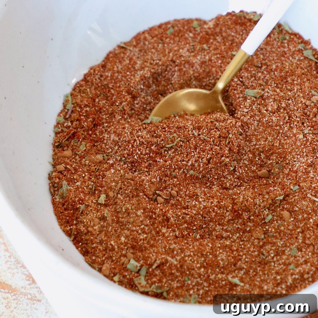 enchilada seasoning in bowl with spoon
