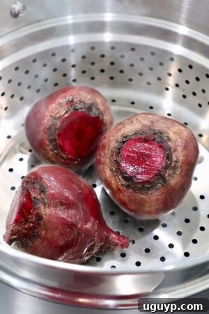 raw beets in steamer basket