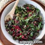 sauteed beet greens in bowl with wooden spoon