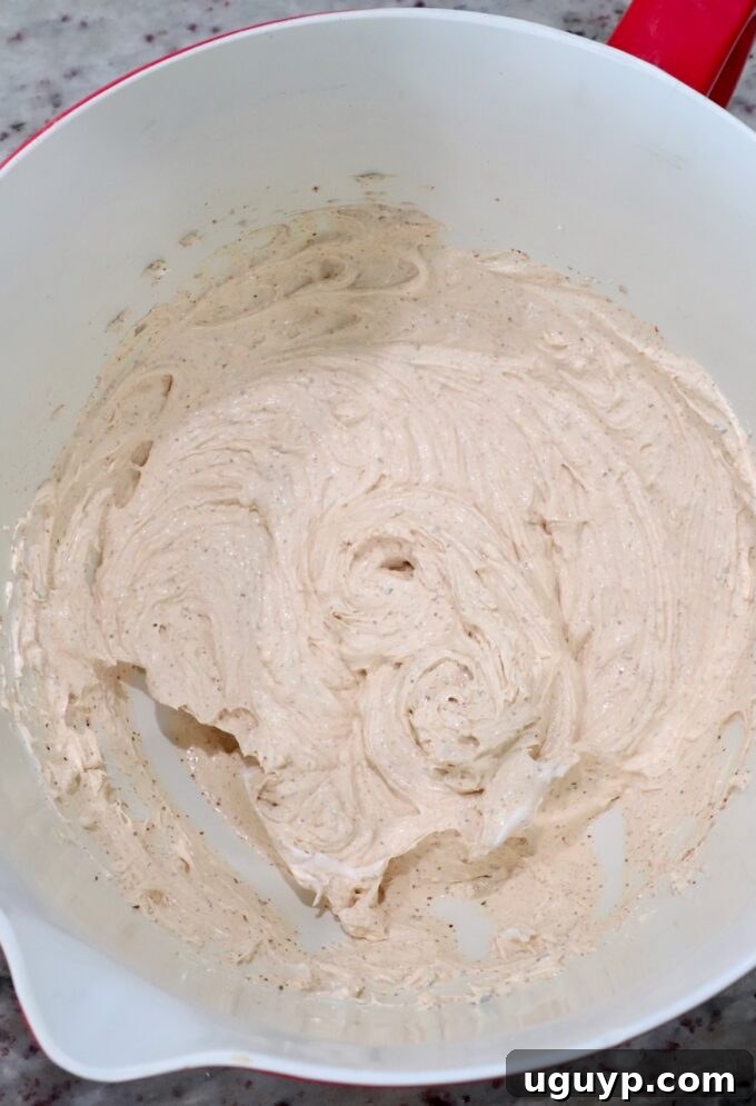 cream cheese, sour cream and spices blended together in large bowl