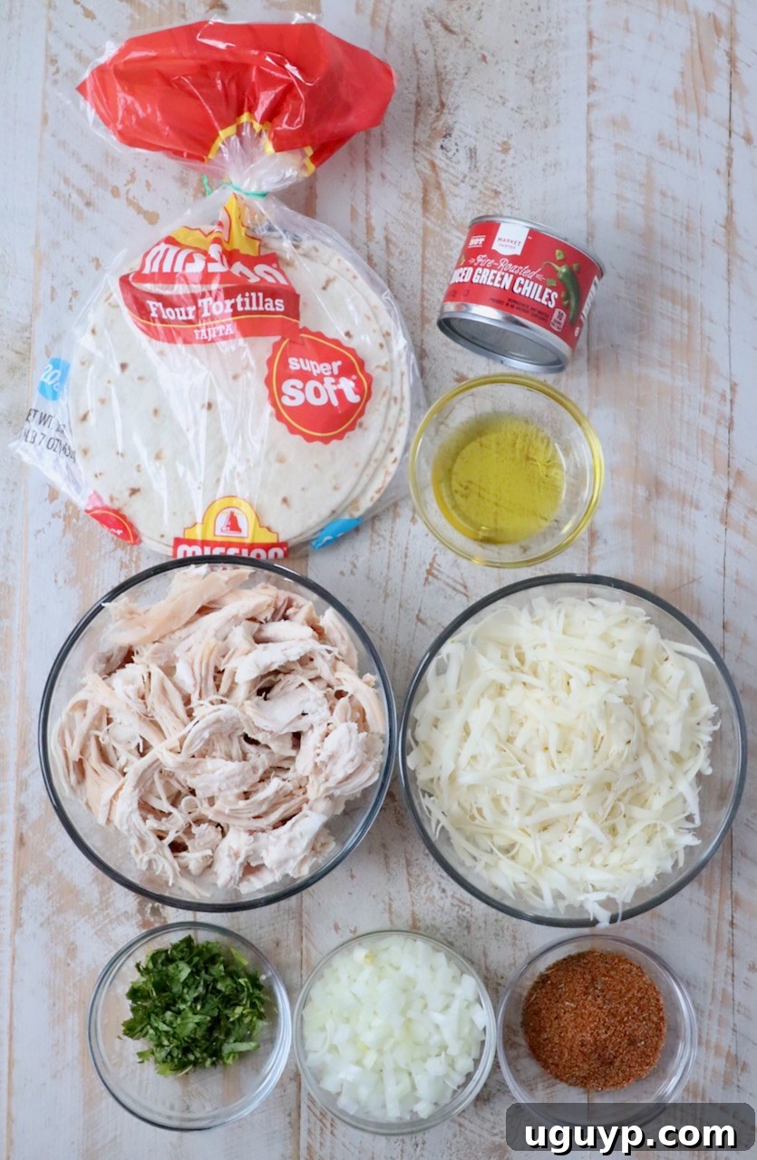 ingredients for air fryer taquitos on white wood board
