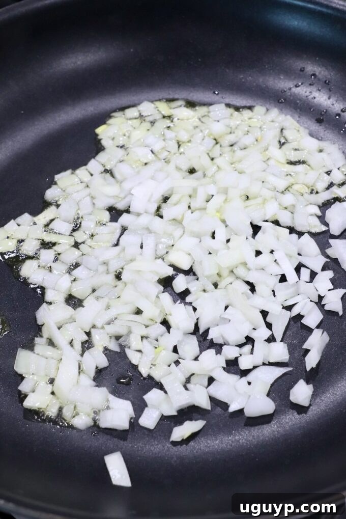 diced onions in skillet