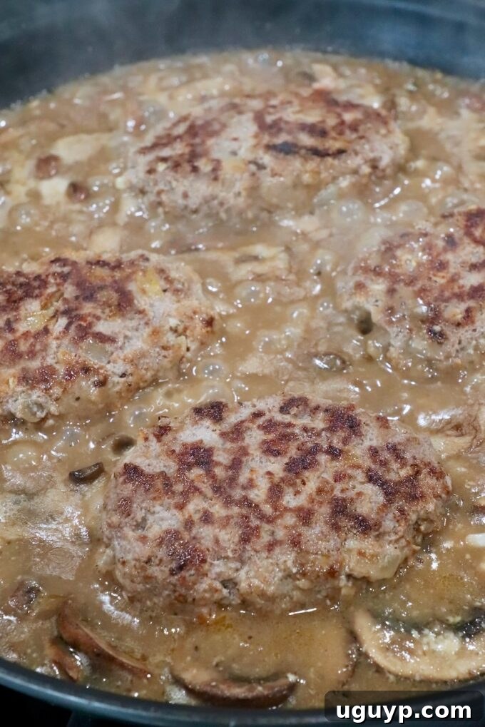 salisbury steak in mushroom gravy on the stove