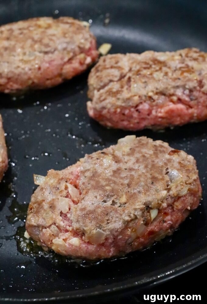 beef patties seared in skillet