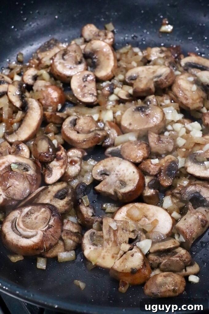 sliced mushrooms in large skillet