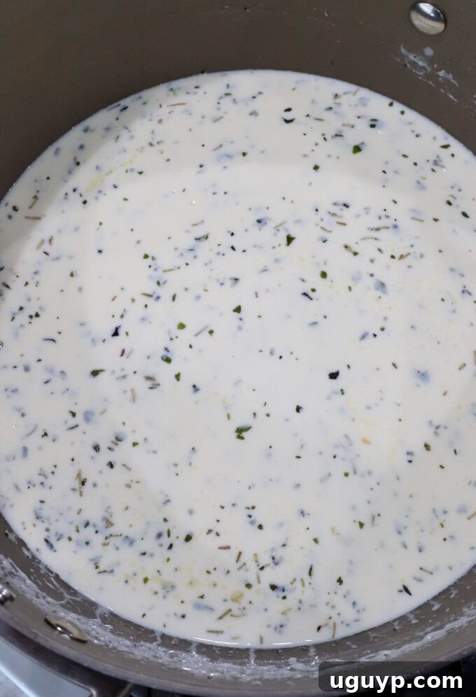 creamy cheese sauce in saucepan