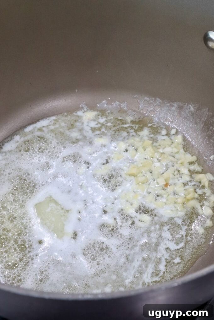 melted butter and minced garlic in saucepan