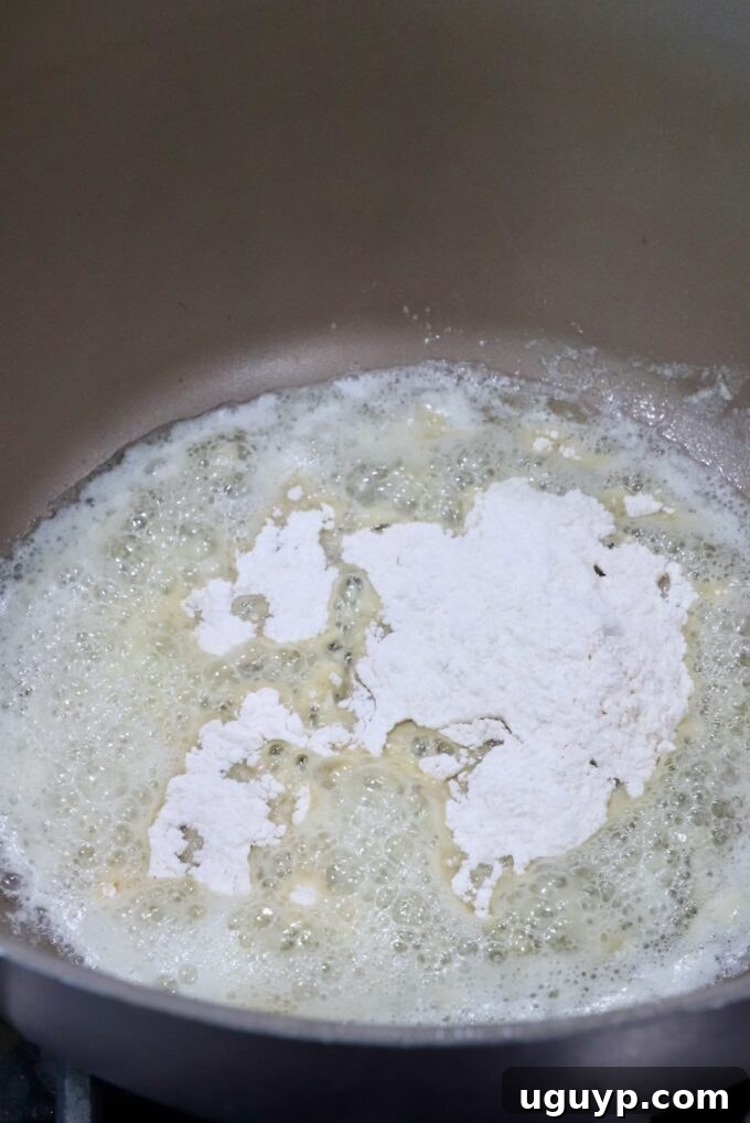 flour in melted butter in a saucepan