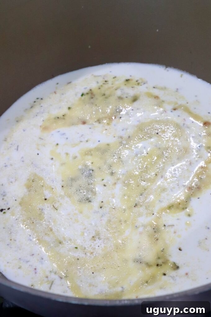 seasoned creamy sauce in saucepan