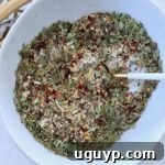 Italian dressing mix in bowl with spoon