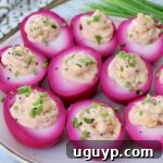 beet pickled deviled eggs on plate