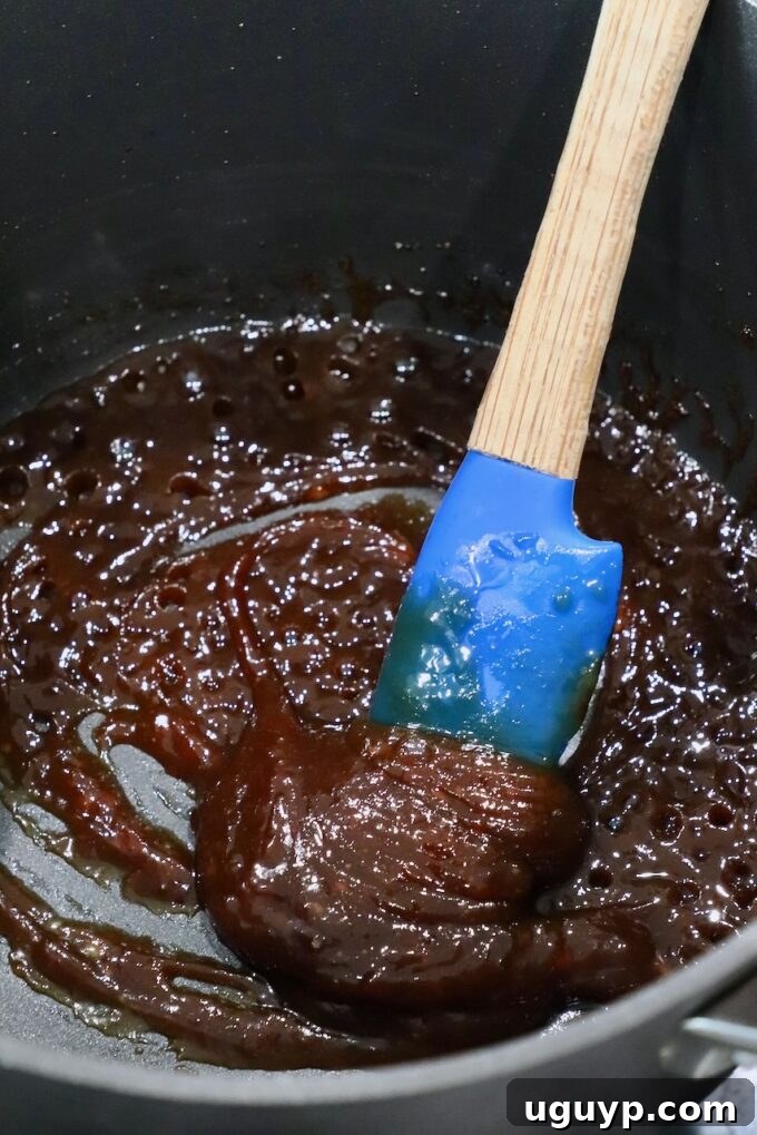 thick miso glaze in pot with spatula