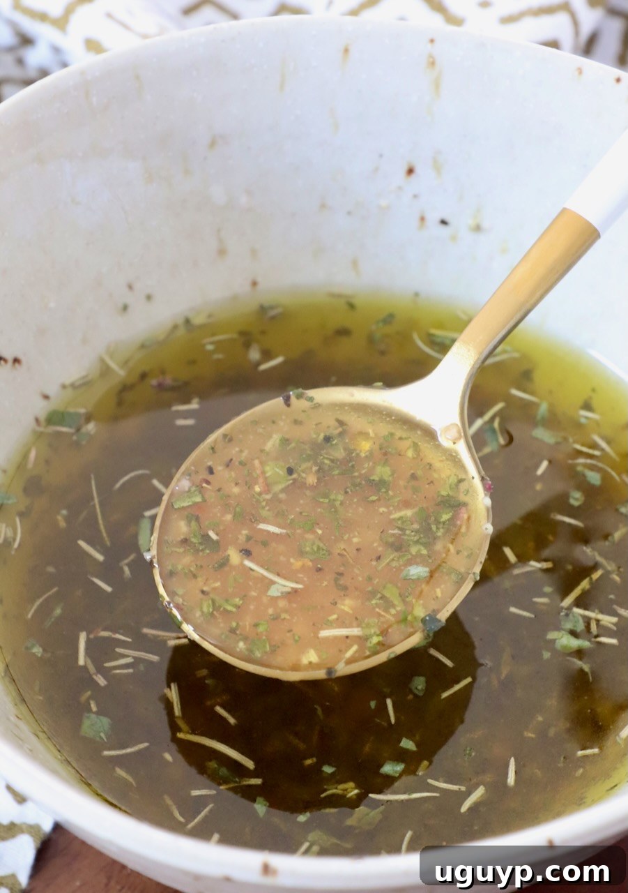 Italian salad dressing in bowl with spoon