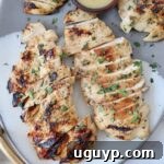 sliced grilled chicken on plate