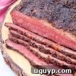 smoked pastrami sliced on wood board