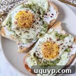 pesto fried eggs on toast on plate