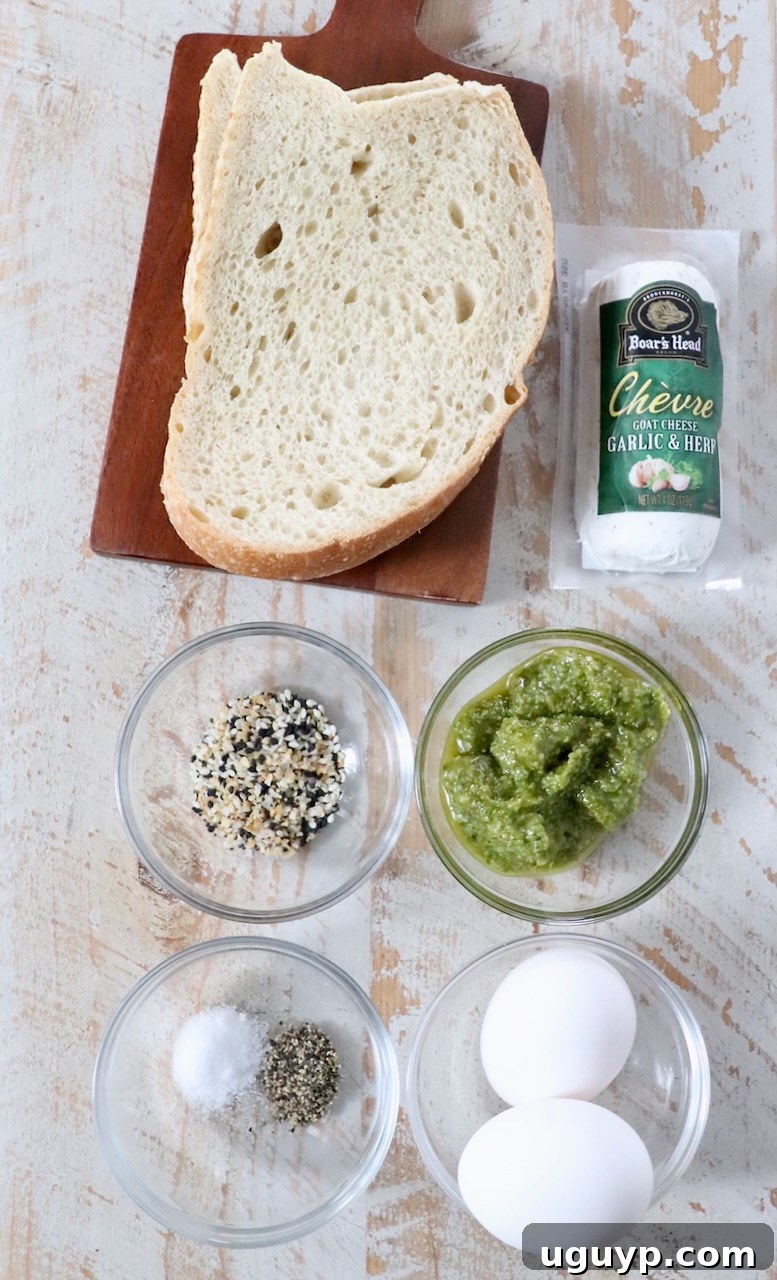 ingredients for pesto eggs on white wood board
