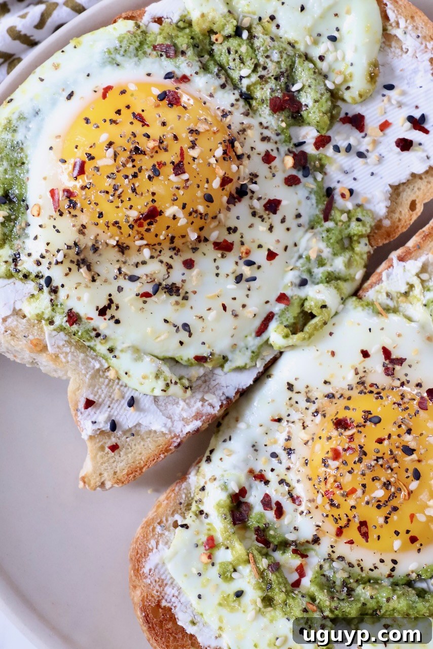 pesto eggs on toast on plate