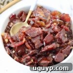 A bowl of homemade bacon jam with a spoon.