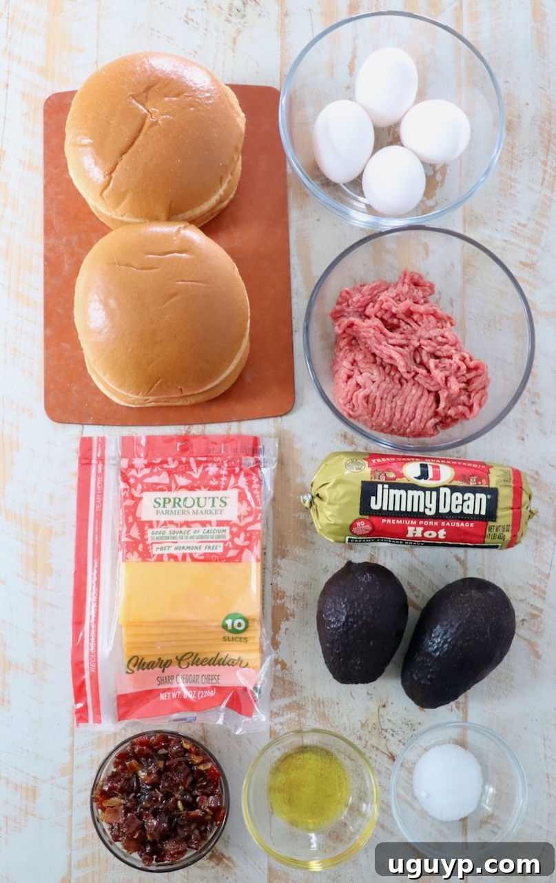 A collection of fresh ingredients for breakfast burgers, neatly arranged on a white wooden board, ready for preparation.