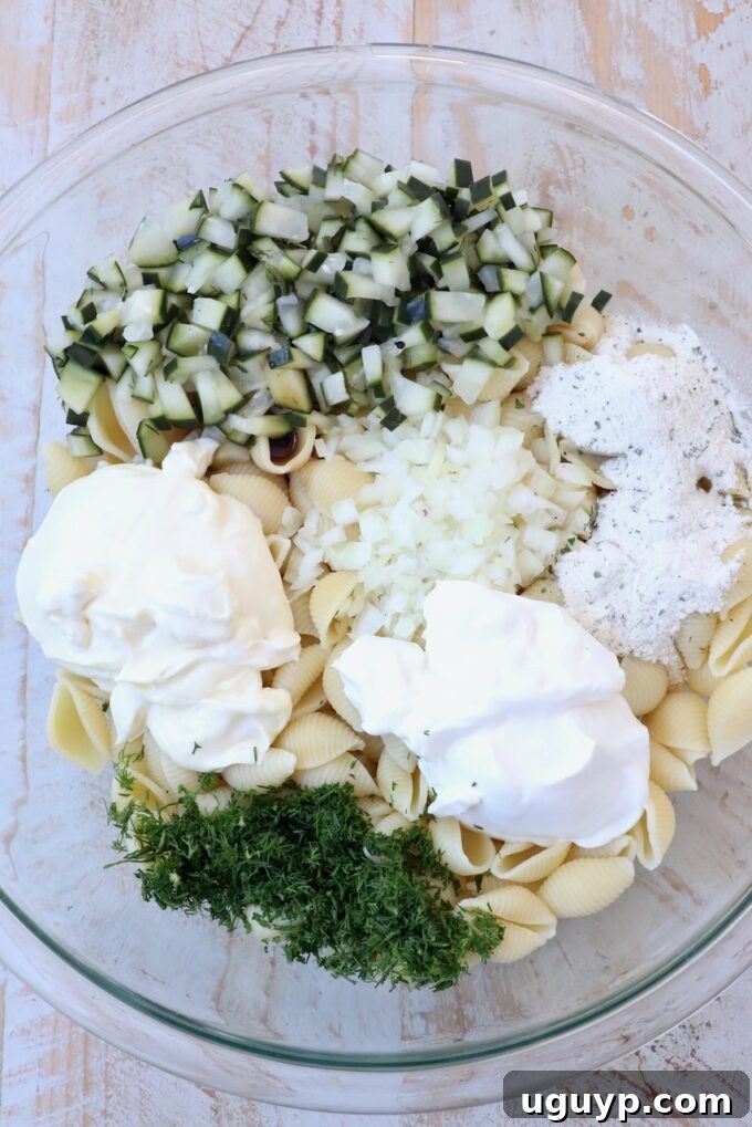ingredients for pickle pasta salad separated in bowl