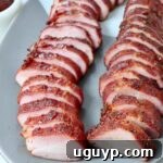 sliced pork tenderloin on plate