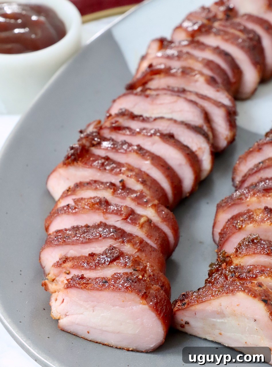 sliced smoked pork tenderloin on plate