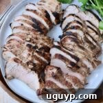 sliced grilled pork tenderloin on plate