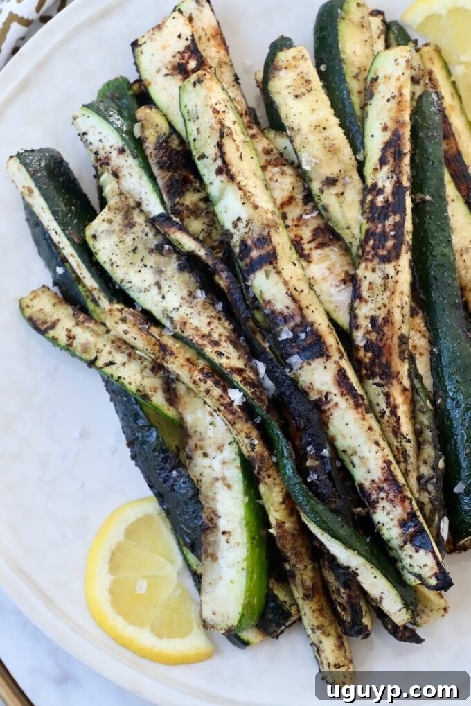 Plate of perfectly grilled zucchini spears, ready to serve
