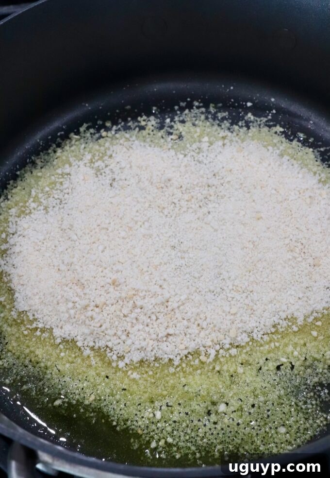 breadcrumbs with olive oil in skillet