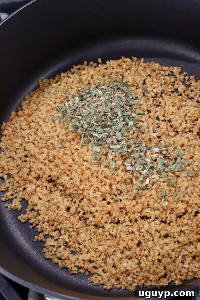 toasted breadcrumbs with herbs and spices in skillet
