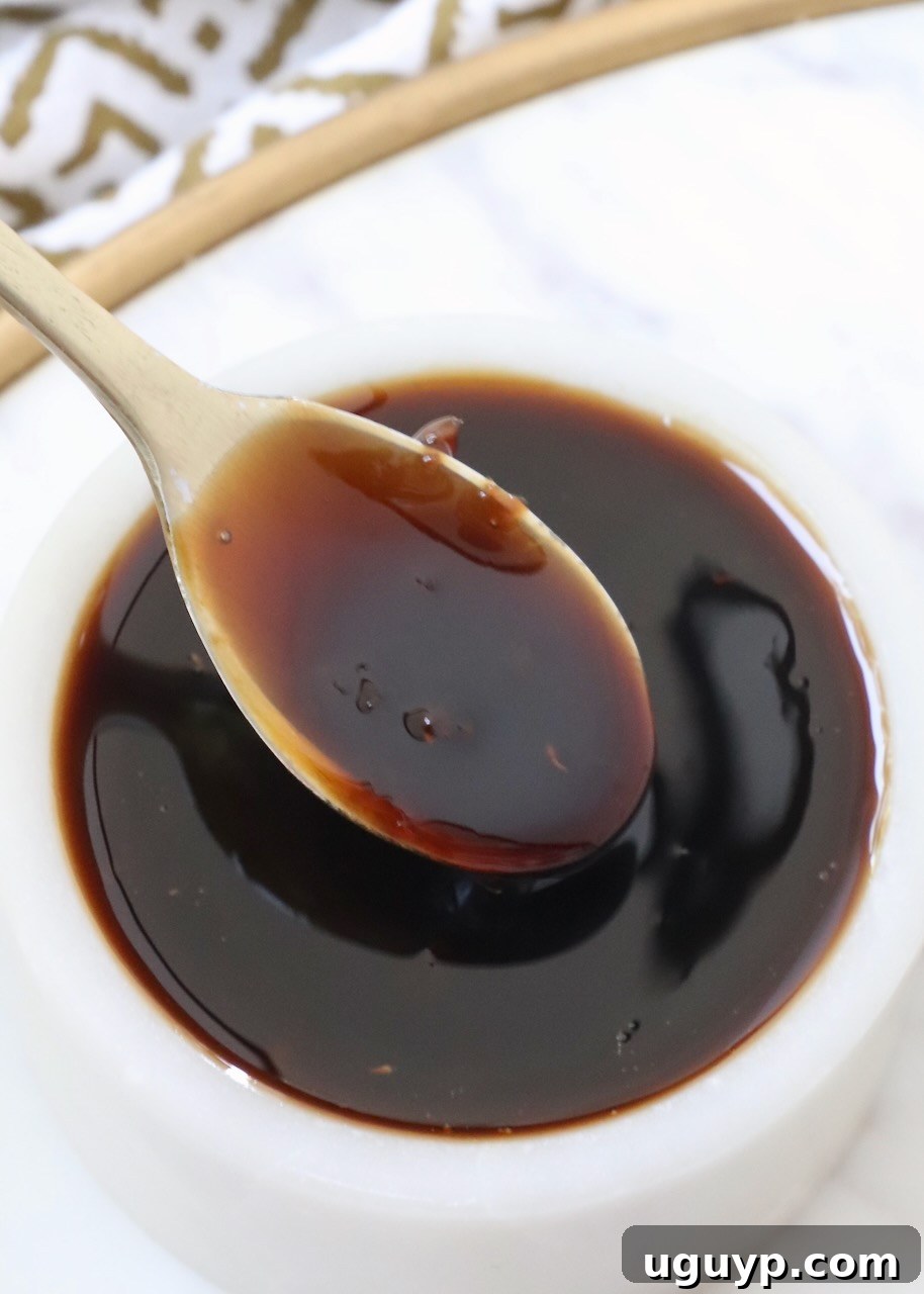 teriyaki sauce in a small bowl with a small spoon