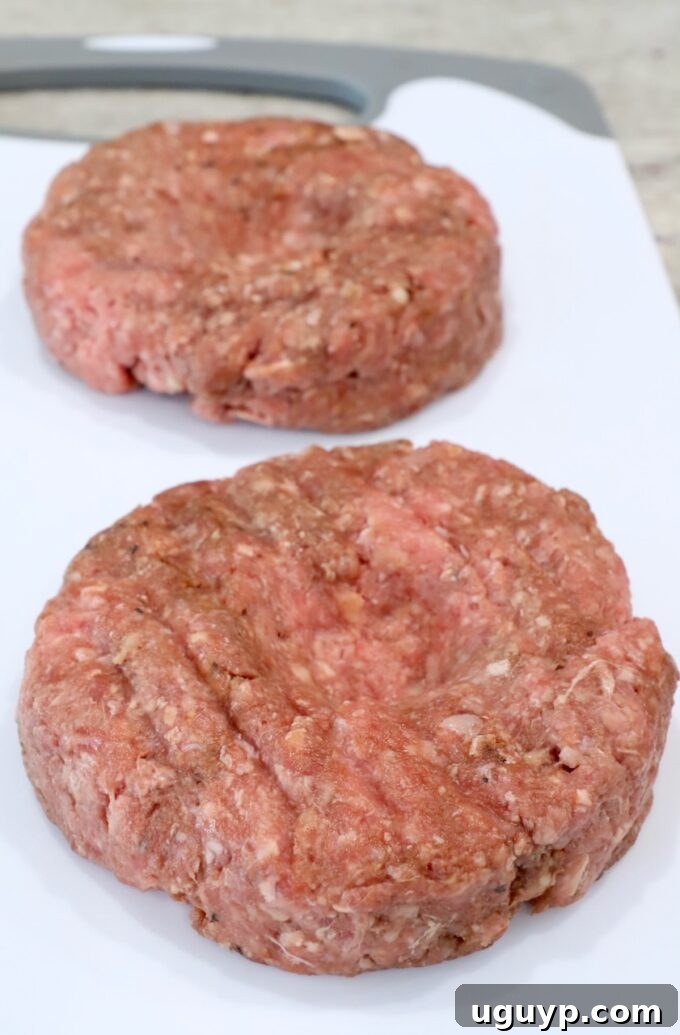 burger patties on cutting board