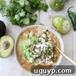 This flavorful Green Chili Chicken Enchilada Soup made with roasted chilies, tomatillos, fresh herbs & chicken is sure to be your new favorite soup recipe!
