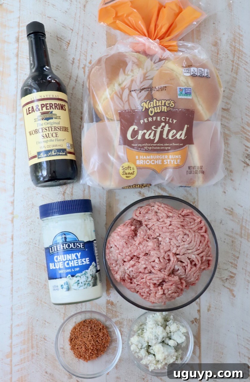 Ingredients for Blue Cheese Burgers Arranged on a White Wooden Board