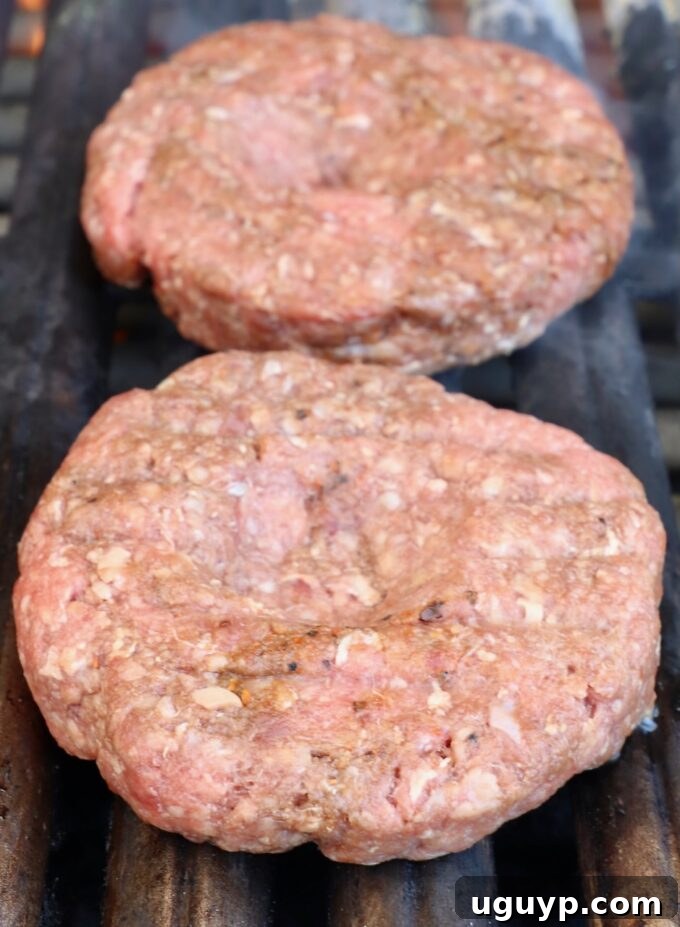 Burger Patties Cooking on a Hot Grill