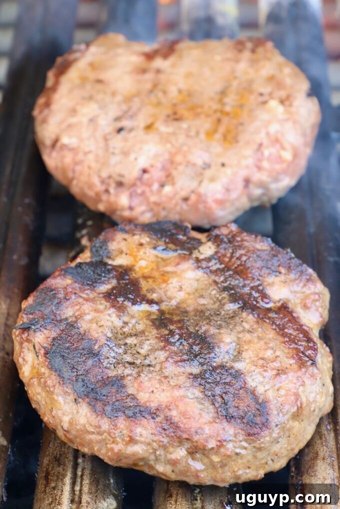 Perfectly Grilled Burger Patties Resting on the Grill Grates