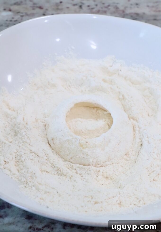 a slice of onion in a bowl of flour