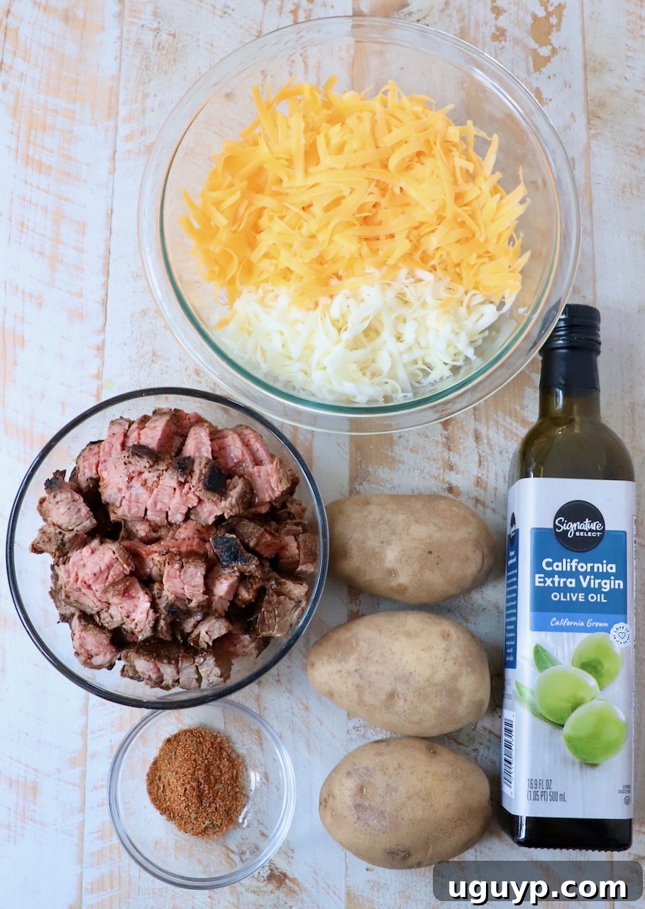 ingredients for carne asada fries on white wood board
