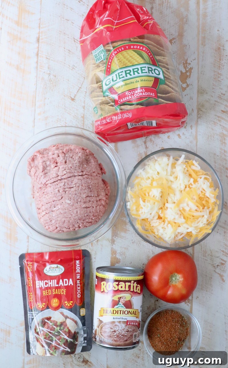 ingredients for Mexican pizza on white wood board