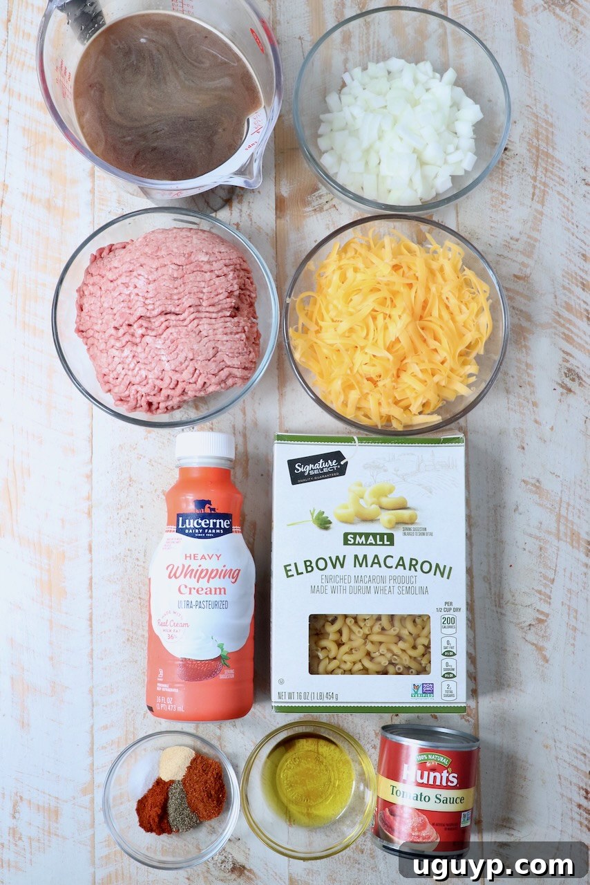 ingredients for homemade hamburger helper on white wood board