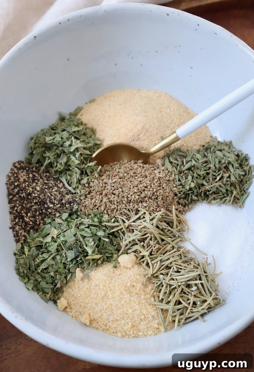 A selection of nine individual herbs and spices meticulously arranged in a bowl, ready to be combined into the ultimate pot roast seasoning blend.