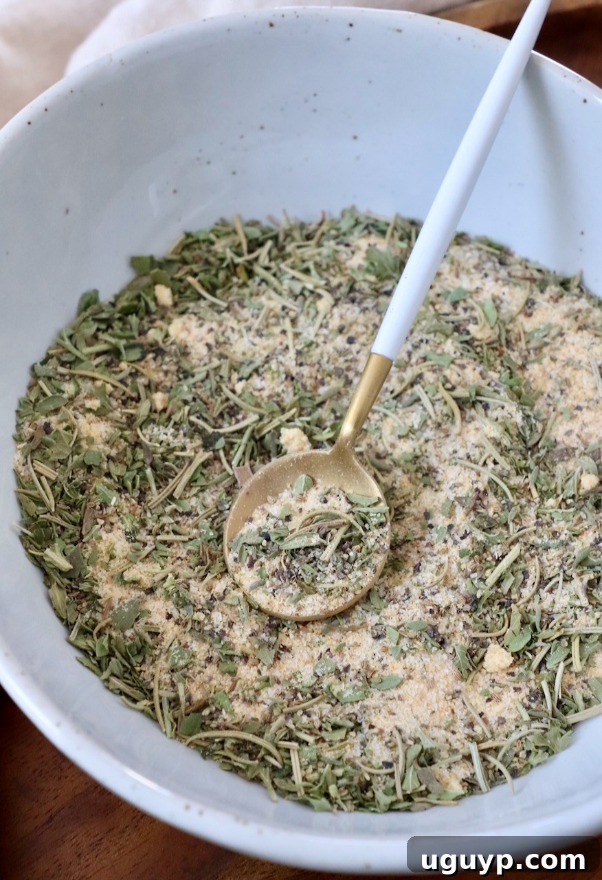 The homemade pot roast seasoning perfectly mixed and presented in a decorative bowl with a small serving spoon, ready for culinary use.
