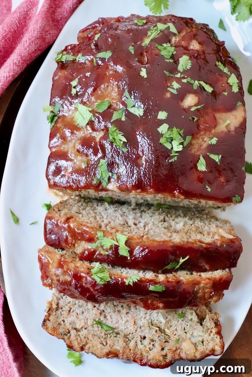 Thick slices of glazed turkey meatloaf served on a plate, ready to be enjoyed.