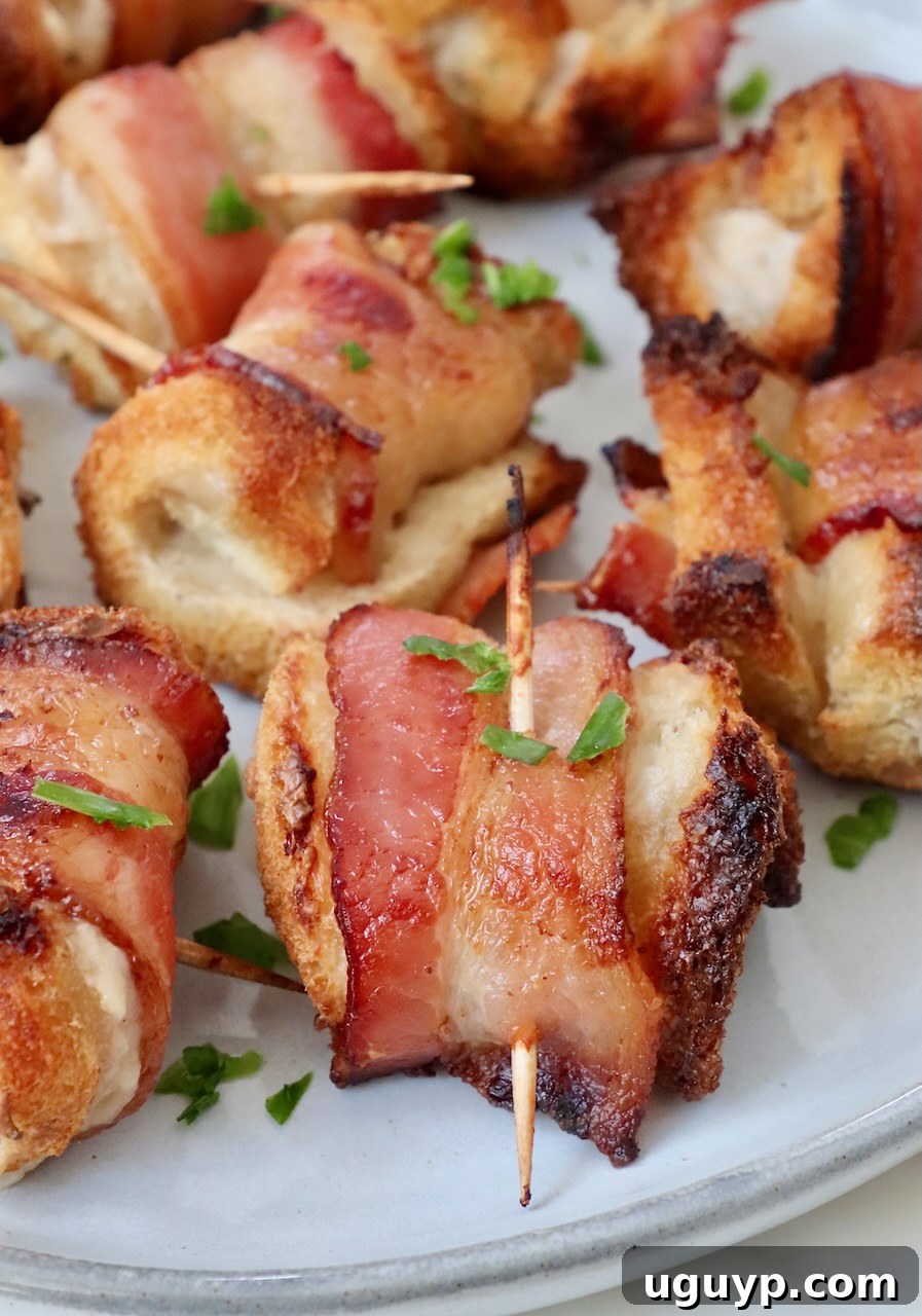 Crispy Bacon Roll Ups garnished with fresh parsley on a serving plate, ready to be enjoyed.