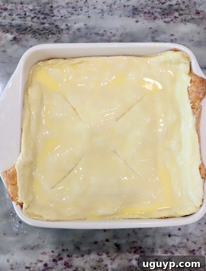 puff pastry dough brushed with egg wash in a baking dish
