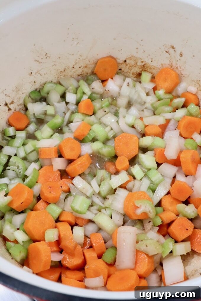 diced vegetables in a cast iron dutch oven