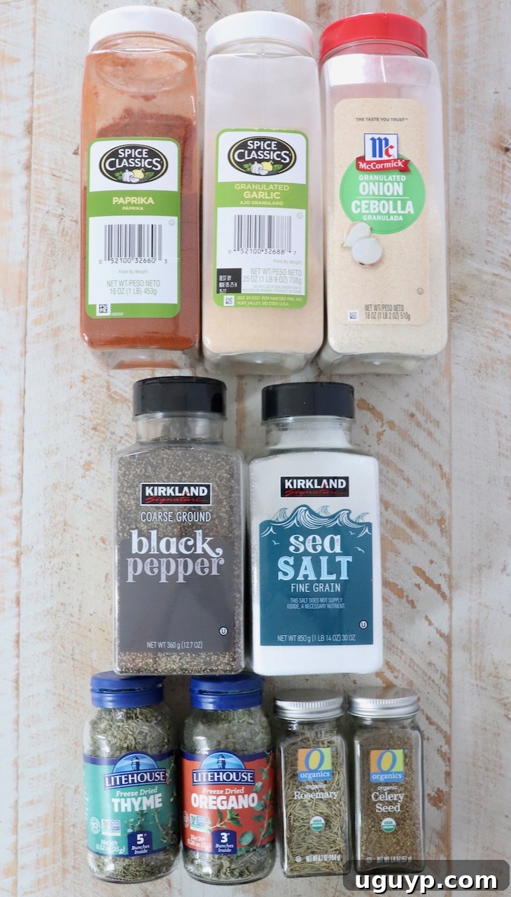 Individual dried herbs and spices, neatly arranged in small containers on a white wooden board, showcasing the fresh ingredients used in the beef stew seasoning.
