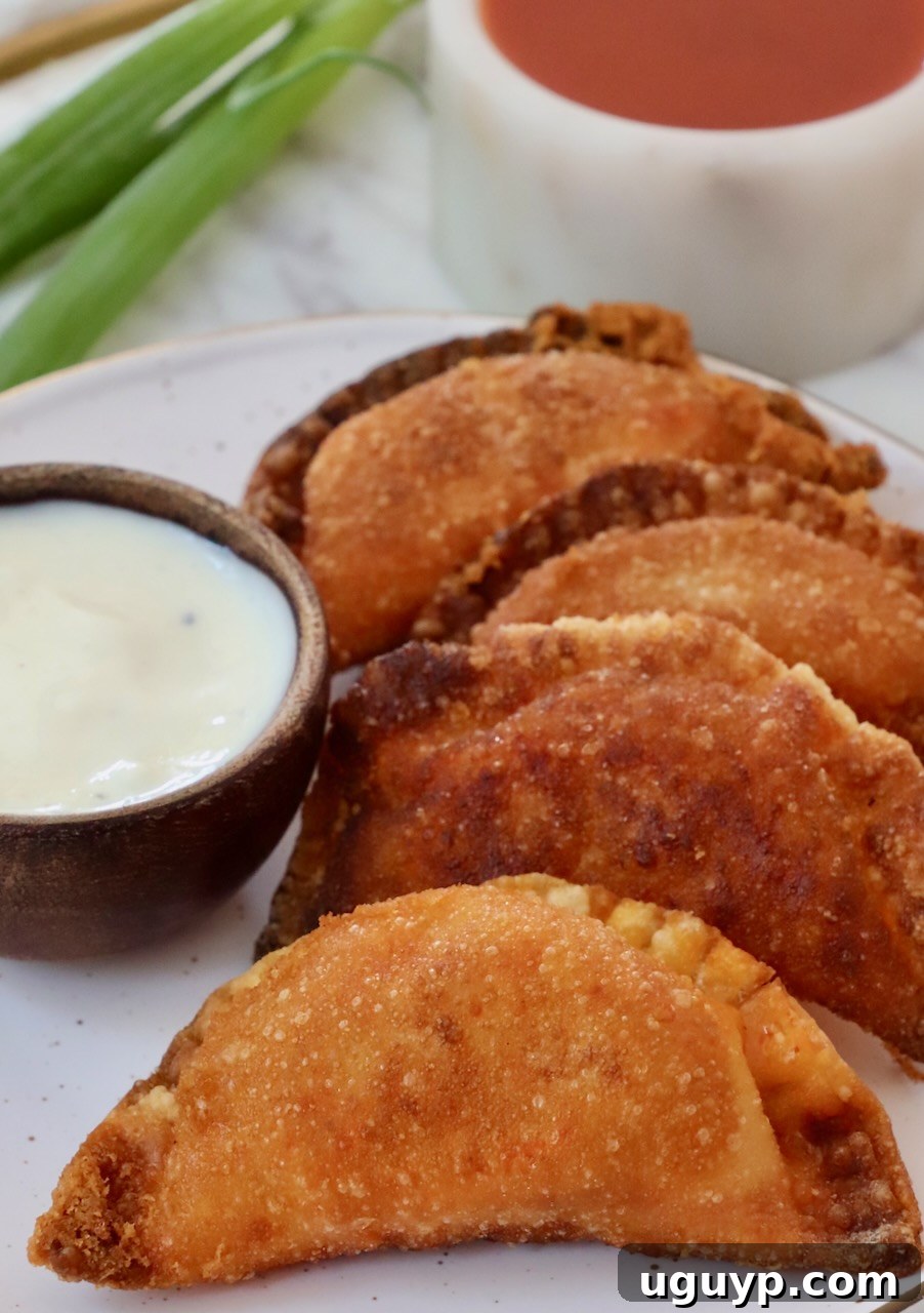 A plate of freshly fried Buffalo chicken bites, showcasing their golden-brown color and inviting texture.