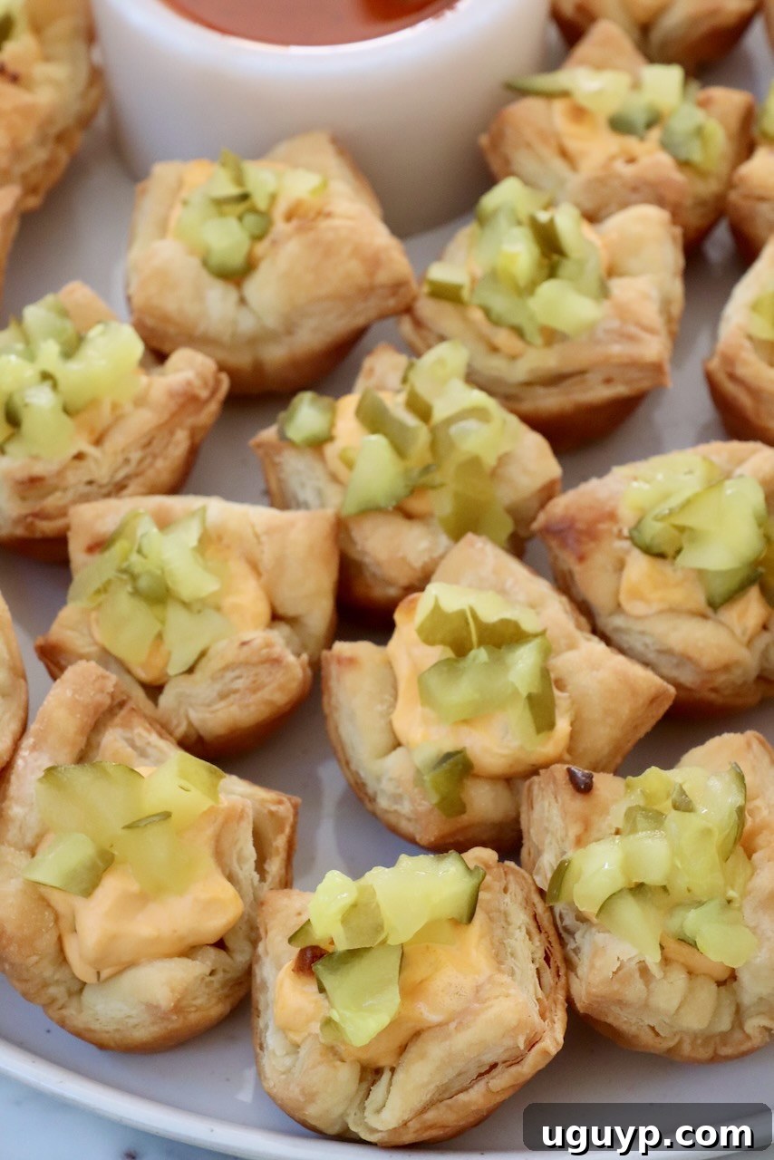 puff pastry pickles bites on a plate